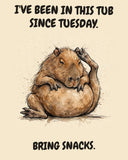 Capybara watercolor art print with the saying "I'VE BEEN IN THIS TUB SINCE TUESDAY. BRING SNACKS."