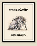 Unicorn watercolor art print with the saying "MY MAGIC IS CLOSED FOR THE HOLIDAYS." shown framed with a cream mat — frame for display only, not included