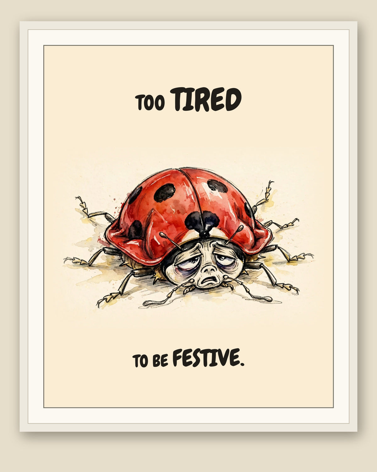 Ladybug watercolor art print with the saying "TOO TIRED TO BE FESTIVE." shown framed with a cream mat — frame for display only, not included