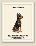 Framed display mockup — frame not included. Smug Doberman Pinscher art print.