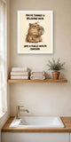 The same print shown hanging in a bathroom — frame for display only, not included
