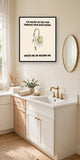 The same print shown hanging in a bathroom — frame for display only, not included