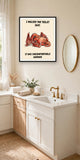 The same print shown hanging in a bathroom — frame for display only, not included