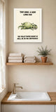 The same print shown hanging in a bathroom — frame for display only, not included