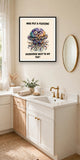The same print shown hanging in a bathroom — frame for display only, not included