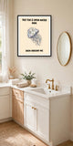 The same print shown hanging in a bathroom — frame for display only, not included