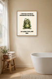 The same print shown hanging in a bathroom — frame for display only, not included