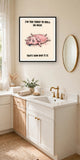 The same print shown hanging in a bathroom — frame for display only, not included