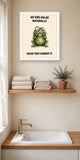 The same print shown hanging in a bathroom — frame for display only, not included