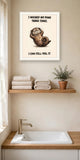 The same print shown hanging in a bathroom — frame for display only, not included