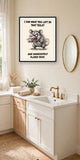 The same print shown hanging in a bathroom — frame for display only, not included