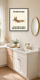The same print shown hanging in a bathroom — frame for display only, not included