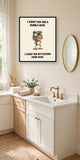The same print shown hanging in a bathroom — frame for display only, not included