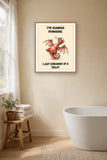 The same print shown hanging in a bathroom — frame for display only, not included