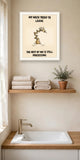 The same print shown hanging in a bathroom — frame for display only, not included