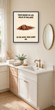 The same print shown hanging in a bathroom — frame for display only, not included