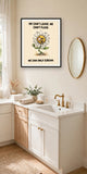 The same print shown hanging in a bathroom — frame for display only, not included