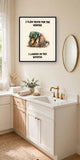 The same print shown hanging in a bathroom — frame for display only, not included