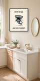 The same print shown hanging in a bathroom — frame for display only, not included