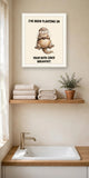 The same print shown hanging in a bathroom — frame for display only, not included