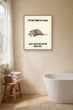 The same print shown hanging in a bathroom — frame for display only, not included