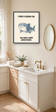 The same print shown hanging in a bathroom — frame for display only, not included