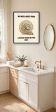 The same print shown hanging in a bathroom — frame for display only, not included