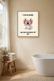 The same print shown hanging in a bathroom — frame for display only, not included