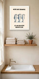 The same print shown hanging in a bathroom — frame for display only, not included