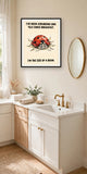 The same print shown hanging in a bathroom — frame for display only, not included