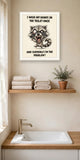 The same print shown hanging in a bathroom — frame for display only, not included