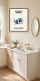 The same print shown hanging in a bathroom — frame for display only, not included