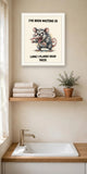 The same print shown hanging in a bathroom — frame for display only, not included