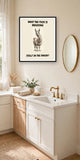 The same print shown hanging in a bathroom — frame for display only, not included