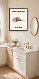 The same print shown hanging in a bathroom — frame for display only, not included