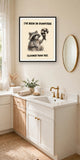 The same print shown hanging in a bathroom — frame for display only, not included