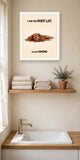 The same print shown hanging on a wall — frame for display only, not included