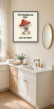 The same print shown hanging in a bathroom — frame for display only, not included
