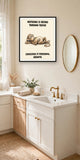 The same print shown hanging in a bathroom — frame for display only, not included