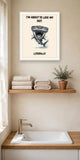 The same print shown hanging in a bathroom — frame for display only, not included