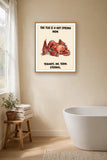 The same print shown hanging in a bathroom — frame for display only, not included