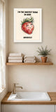 The same print shown hanging in a bathroom — frame for display only, not included