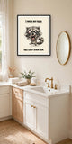 The same print shown hanging in a bathroom — frame for display only, not included