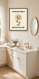 The same print shown hanging in a bathroom — frame for display only, not included