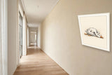 The same wordless print shown hanging on a wall — frame for display only, not included