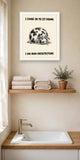 The same print shown hanging in a bathroom — frame for display only, not included