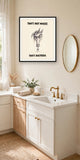 The same print shown hanging in a bathroom — frame for display only, not included