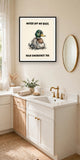 The same print shown hanging in a bathroom — frame for display only, not included