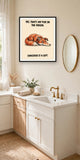 The same print shown hanging in a bathroom — frame for display only, not included