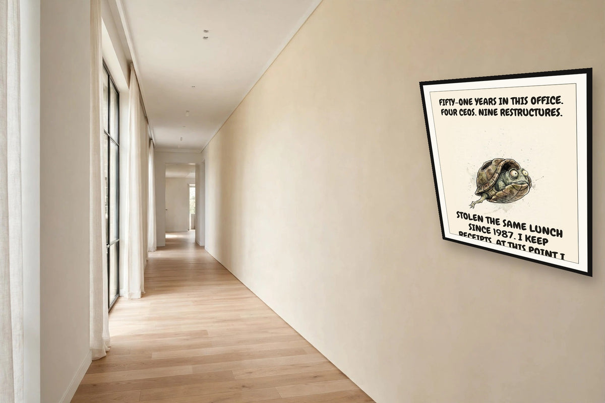 The same print shown hanging in an office — frame for display only, not included